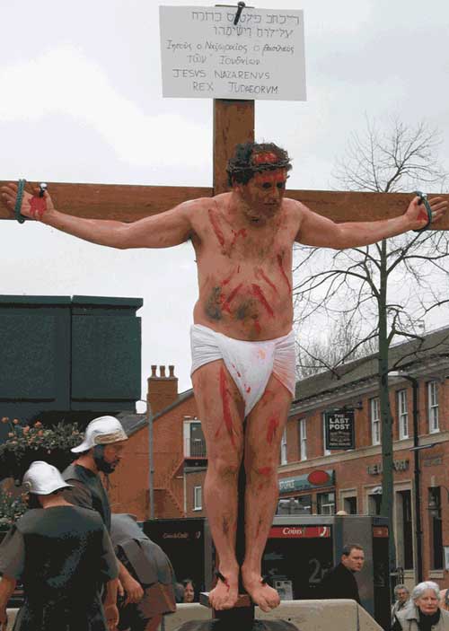 Jesus hangs from the cross