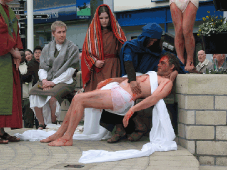 Jesus lays in His mother's arms